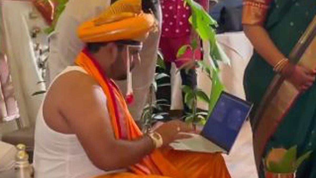 Groom Working on Laptop in wedding