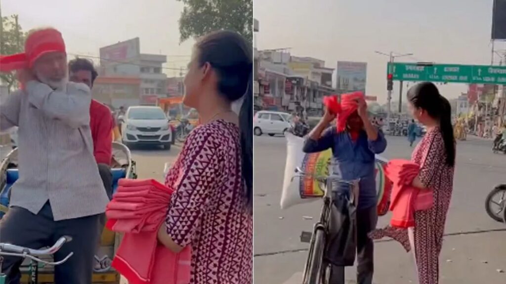 Woman distributes gamcha to rickshaw pullers
